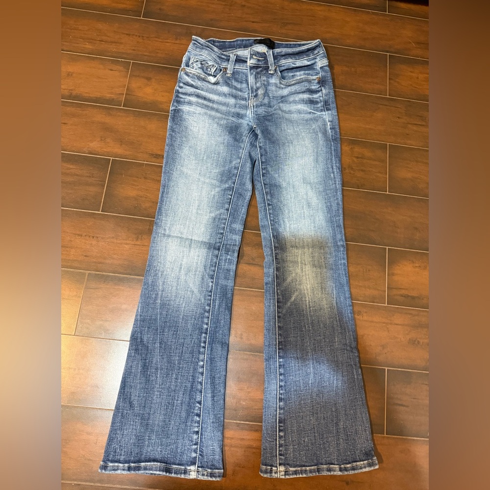 Buckle low rise boot cut jeans